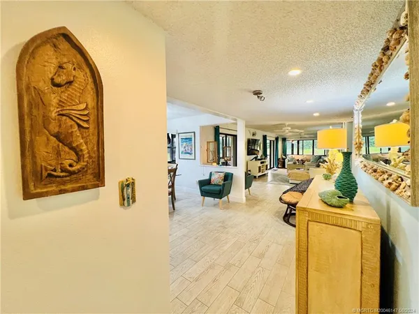 a kitchen with stainless steel appliances granite countertop a stove a sink dishwasher and cabinets with wooden floor