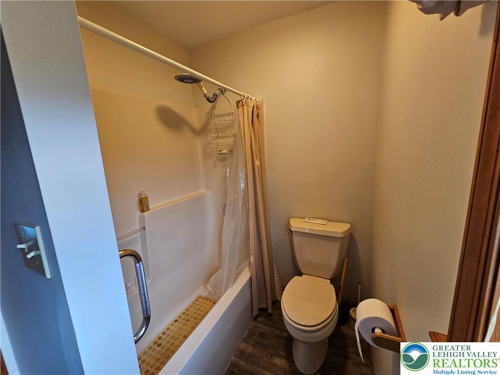 5817 Werleys Corner Road, Unit B New Tripoli, PA 18066 - Photo 11 of 16 a white toilet sitting next to a shower