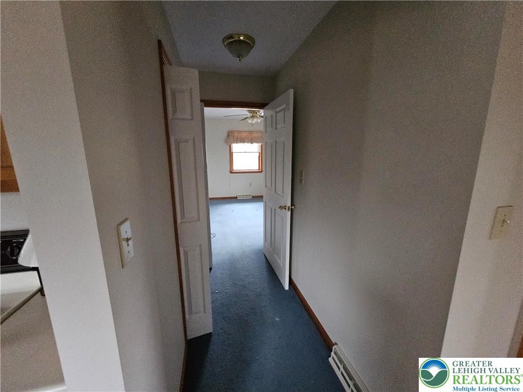 5817 Werleys Corner Road, Unit B New Tripoli, PA 18066 - Photo 12 of 16 a view of a hallway with wooden floor and closet