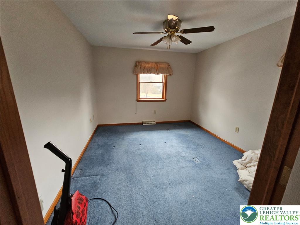 5817 Werleys Corner Road, Unit B New Tripoli, PA 18066 - Photo 16 of 16 wooden floor in an empty room with a window