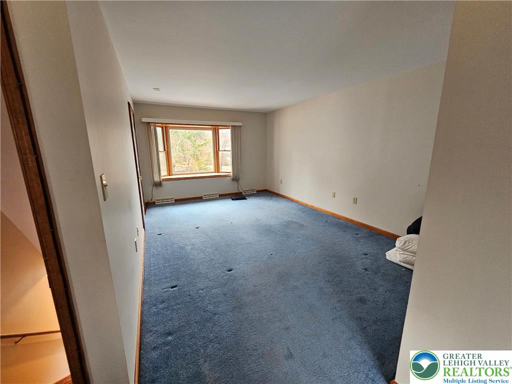 5817 Werleys Corner Road, Unit B New Tripoli, PA 18066 - Photo 5 of 16 an empty room with windows
