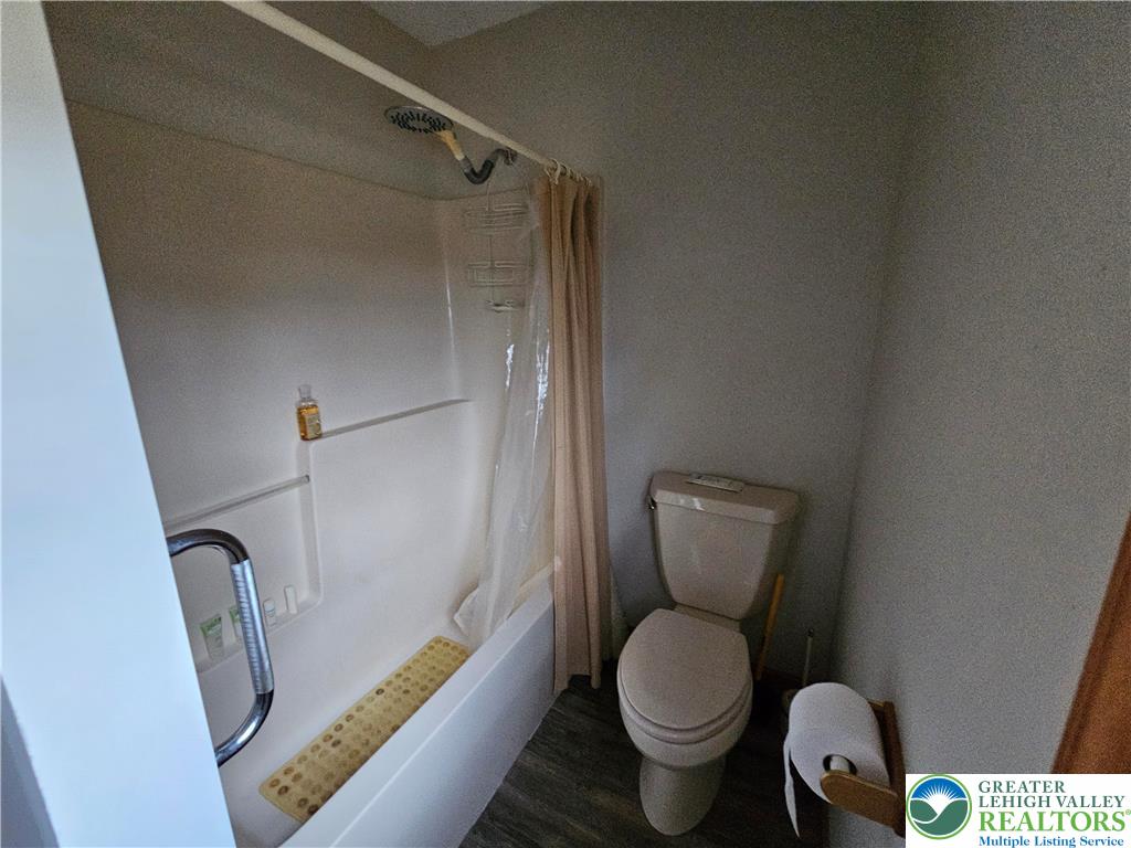 5817 Werleys Corner Road, Unit B New Tripoli, PA 18066 - Photo 10 of 16 a bathroom with a toilet and a shower