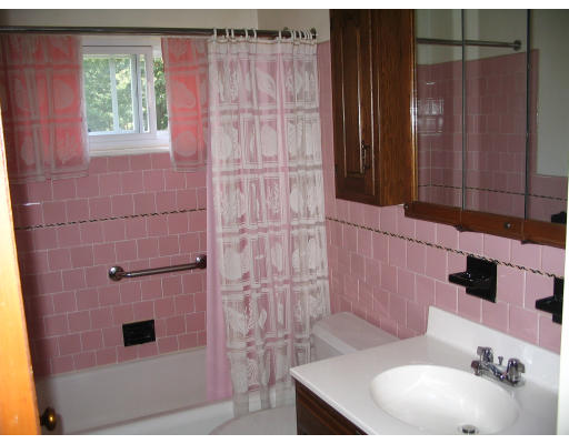 9 Whittemore Road Framingham, MA 01701 - Photo 13 of 15 a bathroom with a sink a toilet and shower