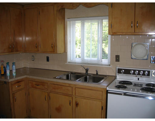 9 Whittemore Road Framingham, MA 01701 - Photo 9 of 15 a kitchen with a sink a stove cabinets and a window