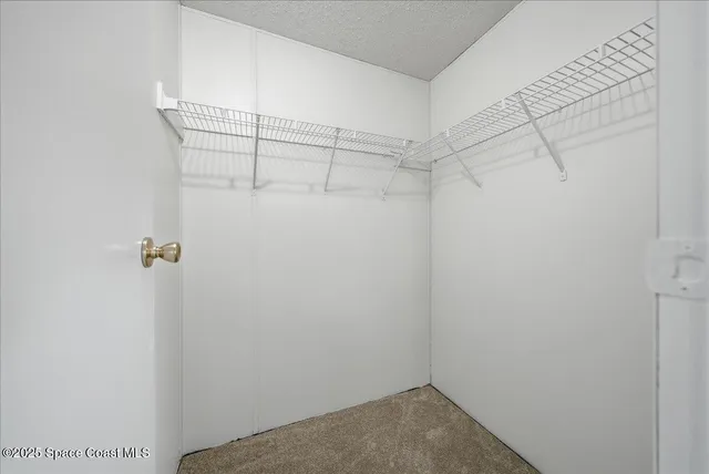 a view of a room with racks on the wall