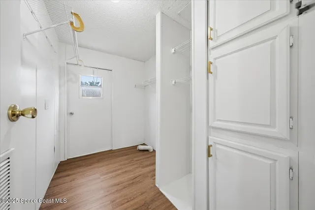 a view of a balcony with wooden floor