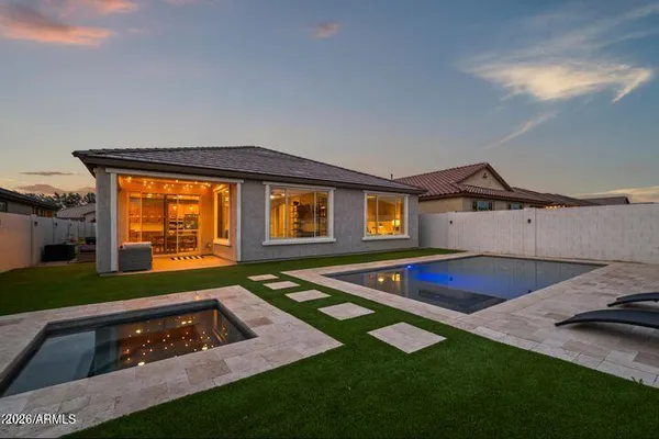 a front view of house with yard and outdoor seating