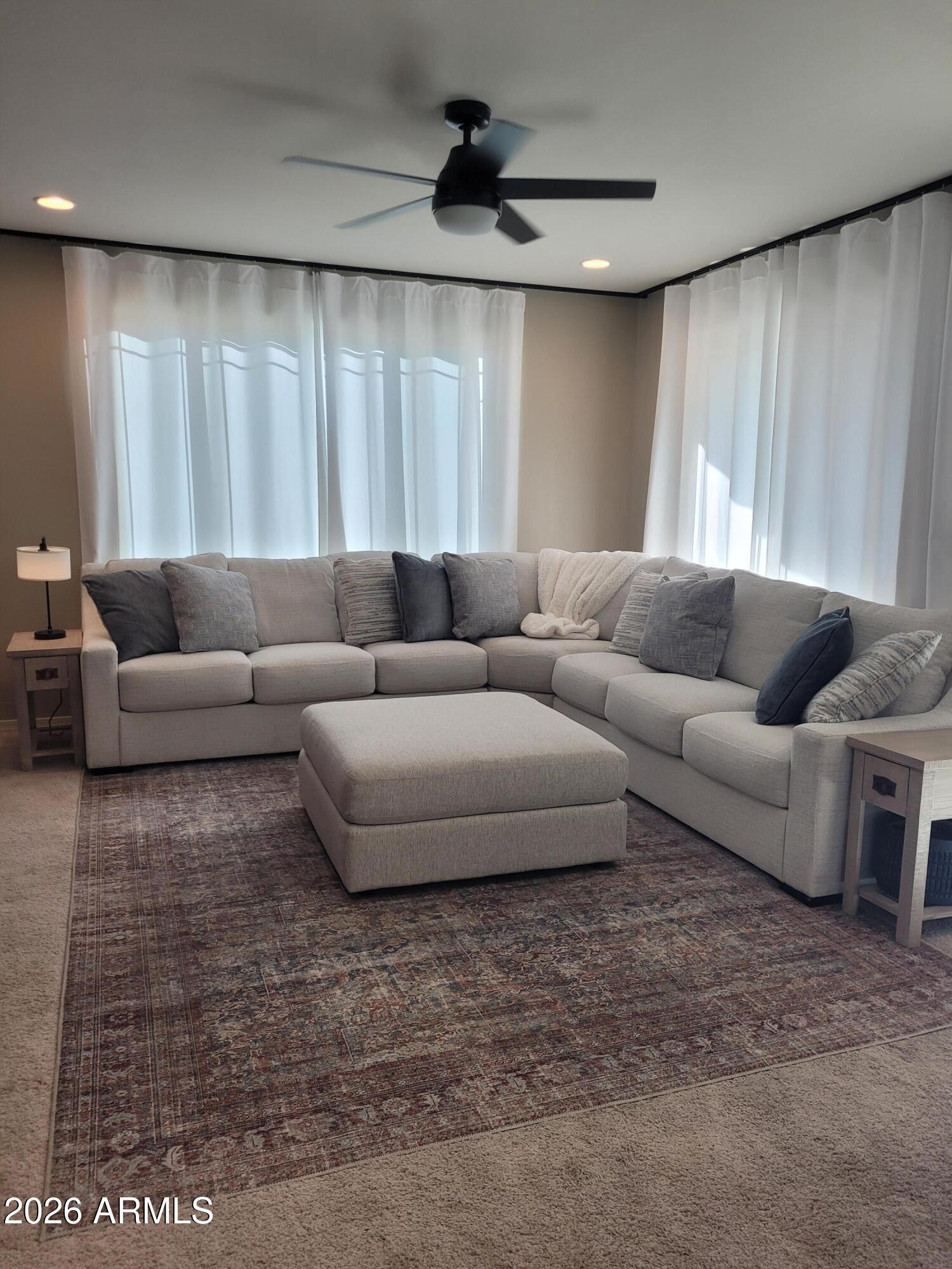 22849 East Marsh Road Queen Creek, AZ 85142 - Photo 14 of 38 a living room with furniture and a rug
