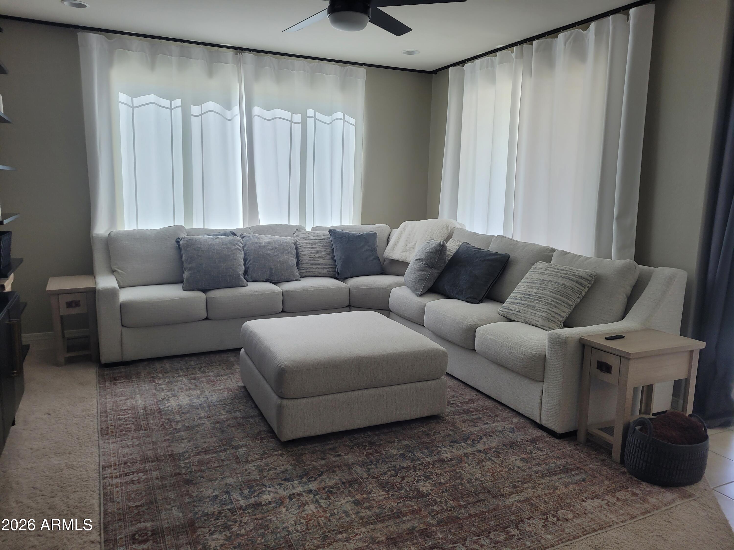 22849 East Marsh Road Queen Creek, AZ 85142 - Photo 16 of 38 a living room with furniture and a large window
