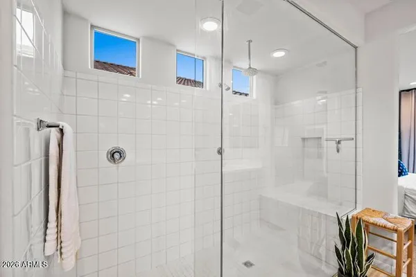 a view of a bathroom with a sink and mirror