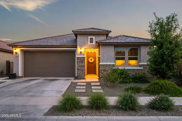 a front view of a house with yard