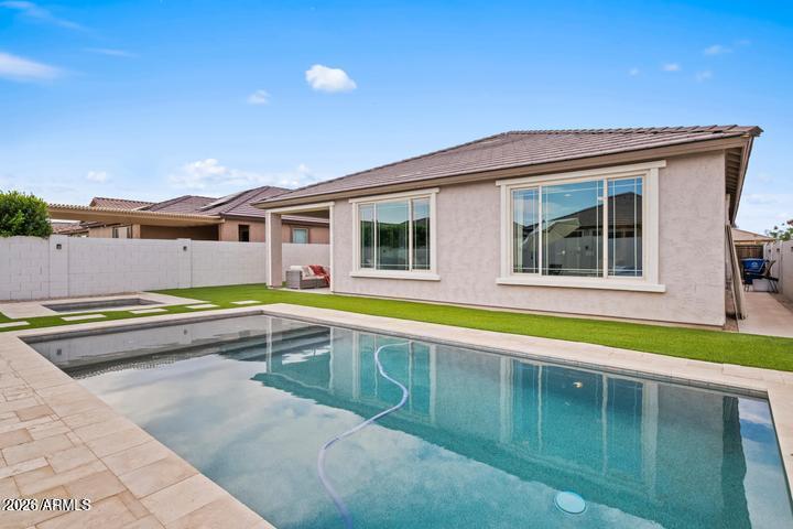 22849 East Marsh Road Queen Creek, AZ 85142 - Photo 3 of 38 a view of a house with a swimming pool and a yard