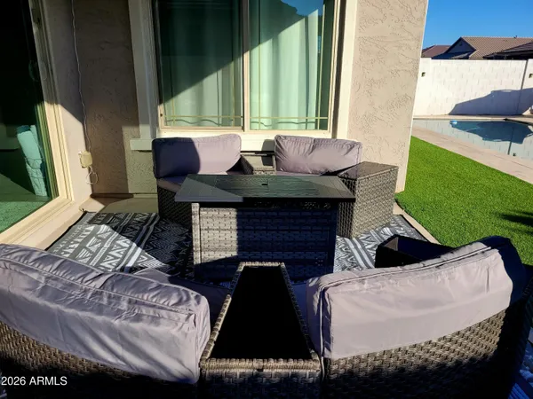 a large kitchen with kitchen island a table and chairs in it