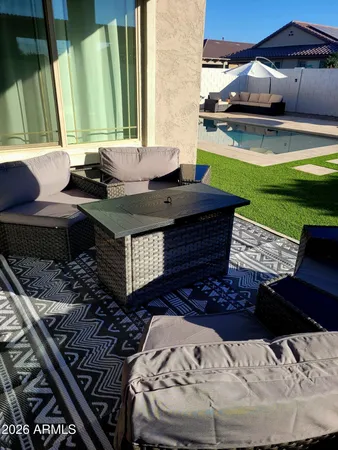 a kitchen with granite countertop a sink stainless steel appliances and cabinets