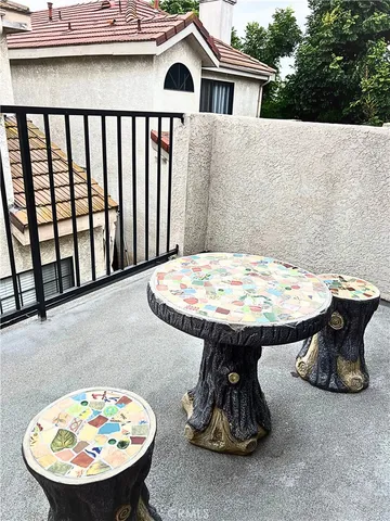 a view of a dinning table and chairs in the patio