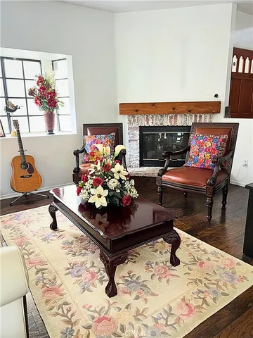 a living room with furniture and a rug