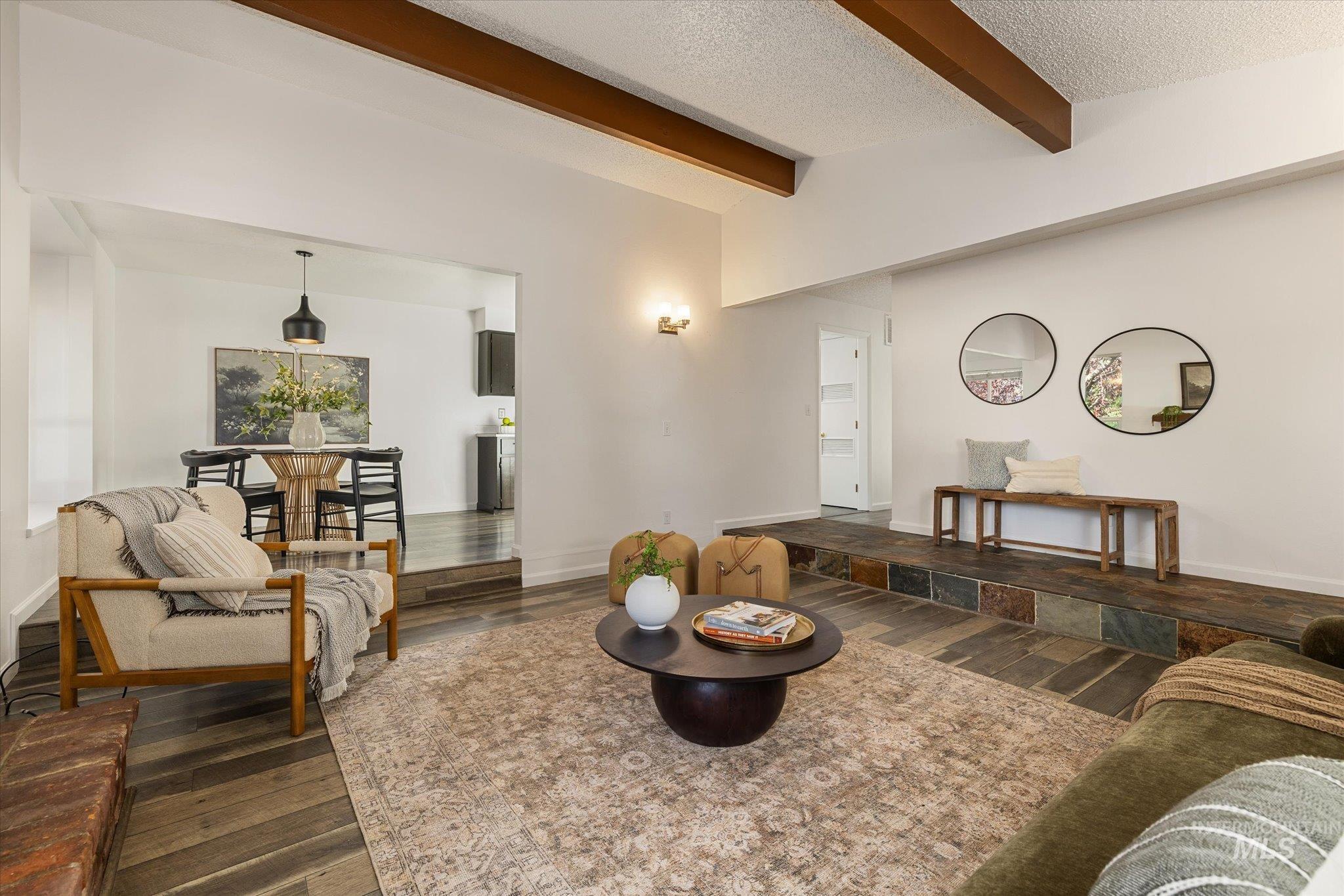 2302 Pendleton Street Boise, ID 83705 - Photo 35 of 35 Living area featuring exposed ceiling beams, wood-finish flooring, and a multi-level floor plan with flagstone-style steps