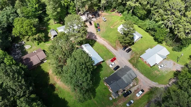 an aerial view of residential house with outdoor space and swimming pool