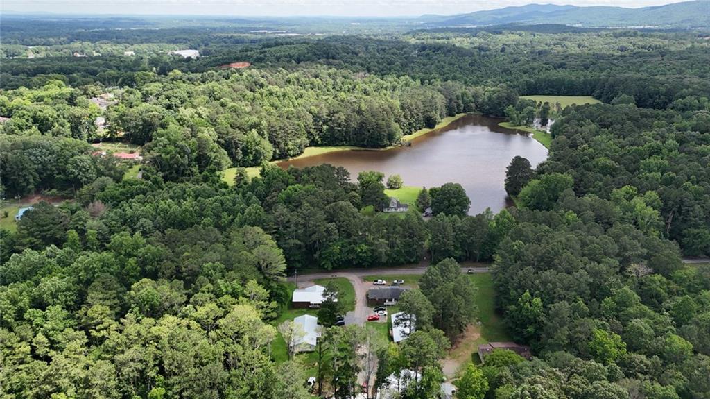 120 Foothill Drive Dalton, GA 30720 - Photo 12 of 55 an aerial view of green landscape with trees houses and mountain view