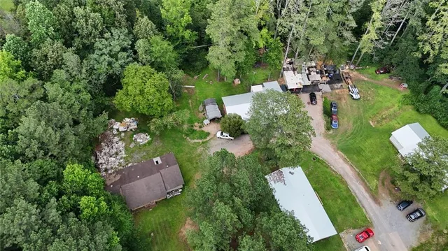 an aerial view of multiple houses with yard