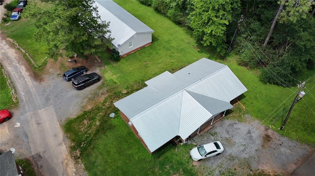 120 Foothill Drive Dalton, GA 30720 - Photo 23 of 55 an aerial view of a house with a yard and lake