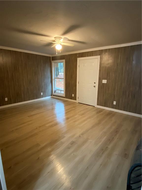 120 Foothill Drive Dalton, GA 30720 - Photo 37 of 55 an empty room with wooden floor and windows with curtains
