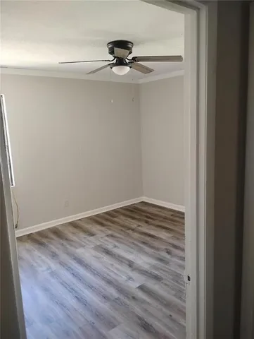 a kitchen with granite countertop cabinets sink and window
