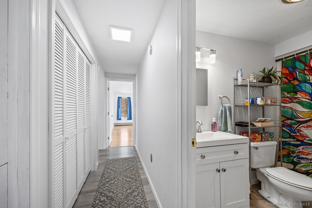 124 East Street Wolcott, CT 06716 - Photo 12 of 39 a view of a hallway to a livingroom and a hallway