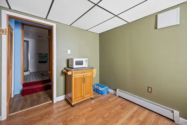 a room with a door open to a room