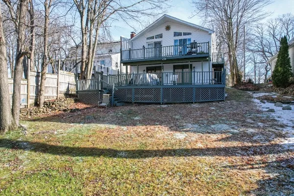 a view of a house with a yard covered with snow in the yard