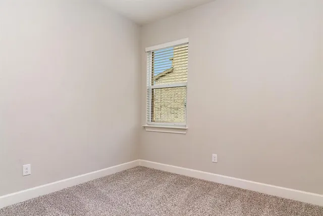a view of a house with a yard and garage