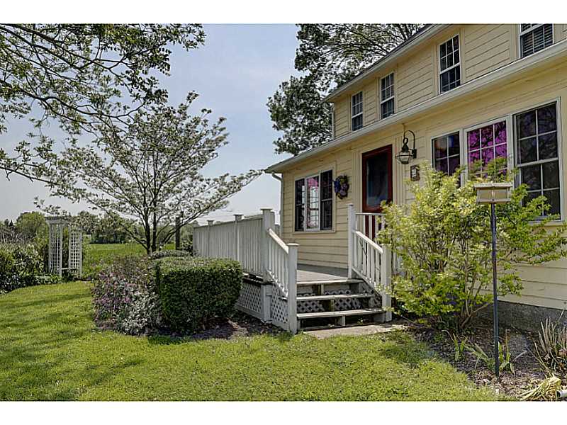 25 Serpentine Road Warren, RI 02885 - Photo 5 of 25 Exterior Front. Front porch to relax and take in views of river and fields.