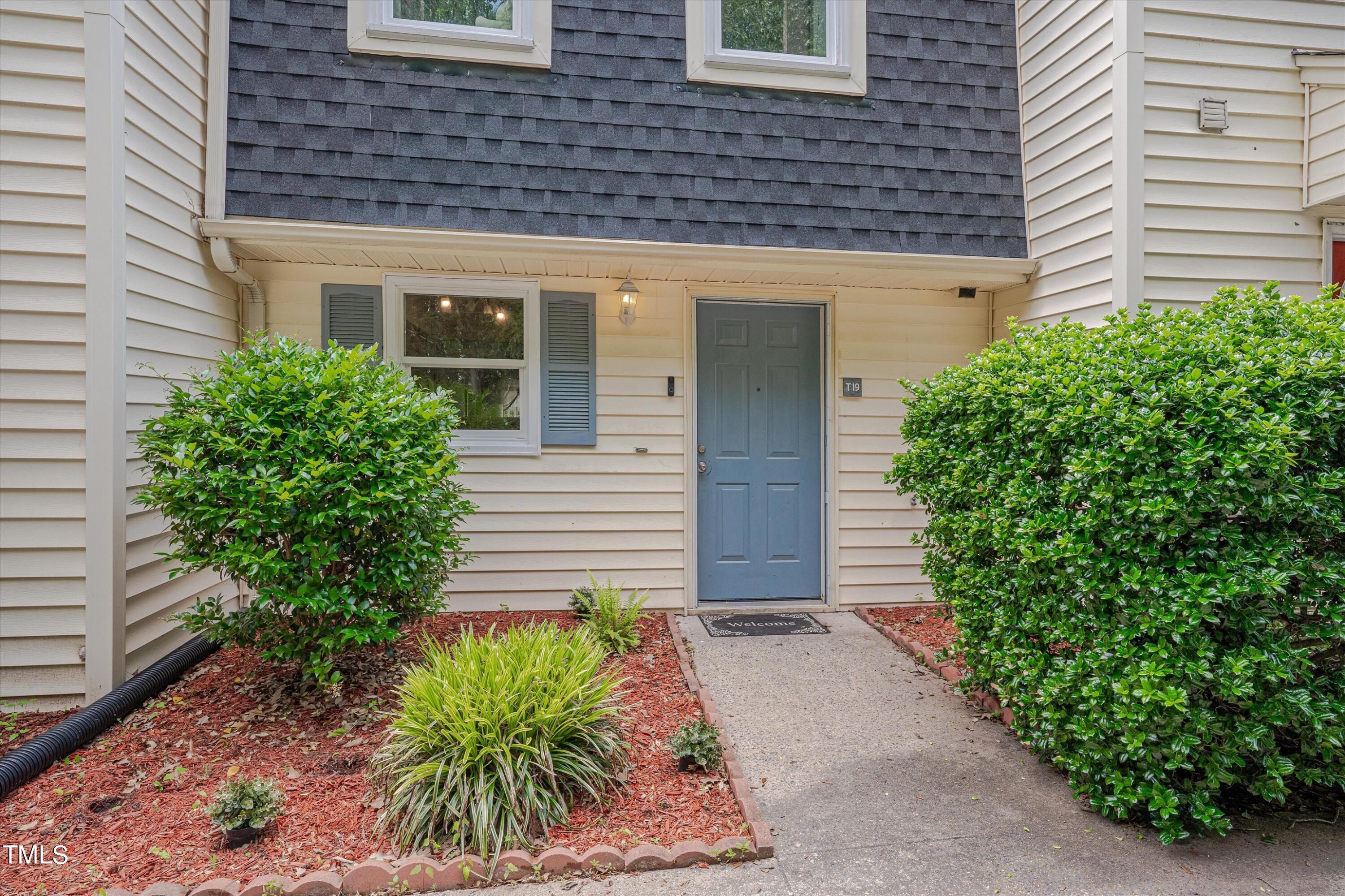 1507 Clermont Road, Unit 19 Durham, NC 27713 - Photo 2 of 22 a front view of a house with garden