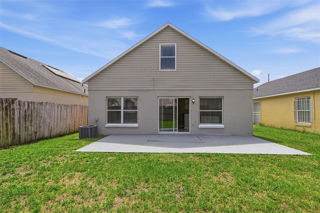 617 Greys Ferry Road Orlando, FL 32811 - Photo 30 of 35 a front view of house with yard and green space