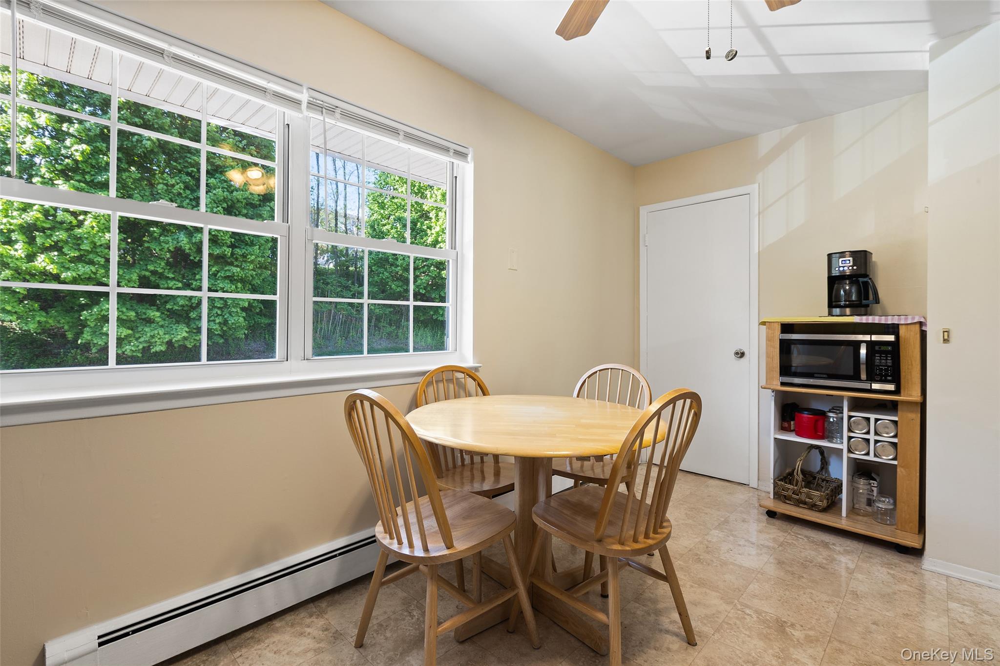 1840 Crompond Road, Unit 5C2 Peekskill, NY 10566 - Photo 11 of 27 a dining room with furniture and a window