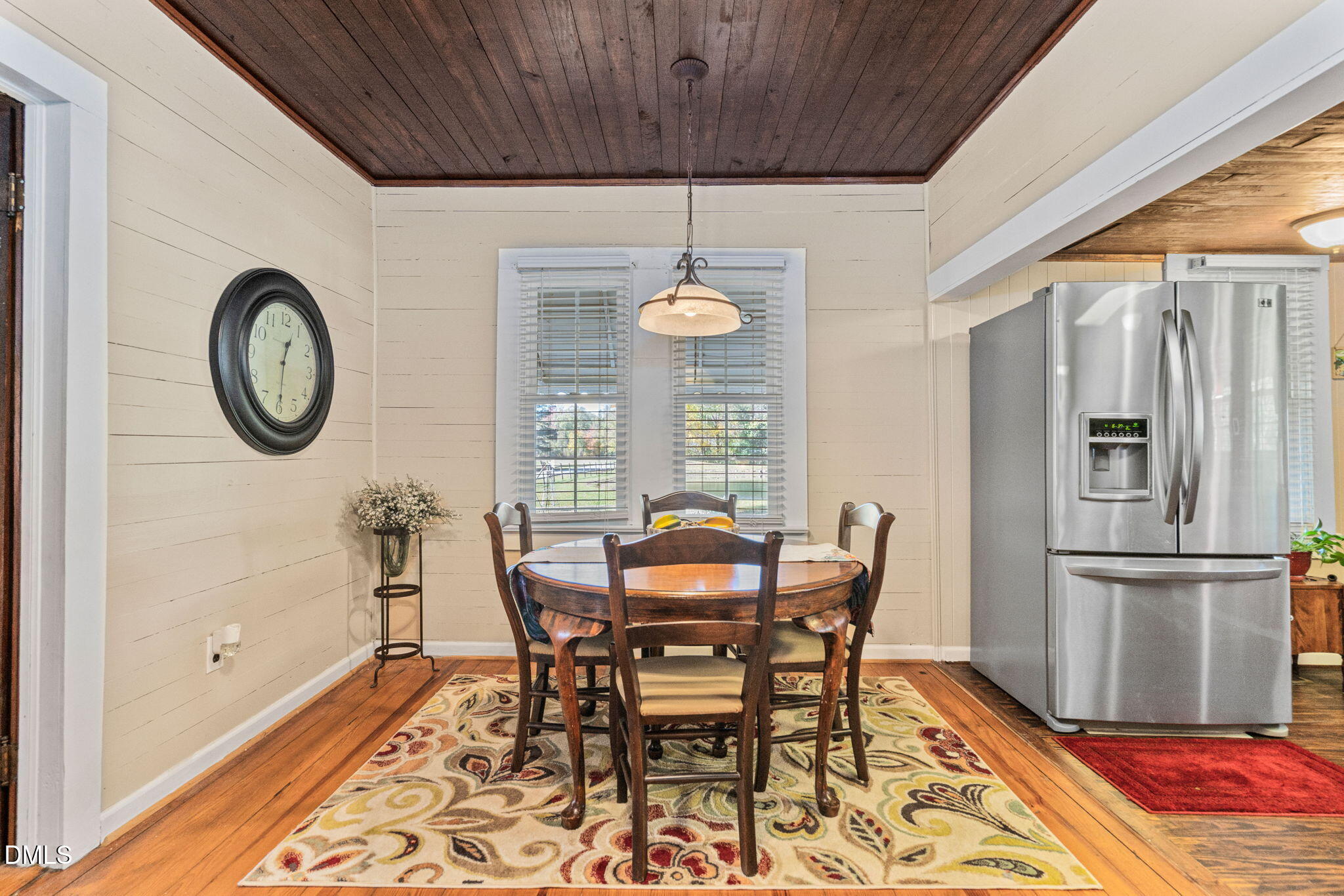 125 Branch Chapel Church Road Selma, NC 27576 - Photo 11 of 39 a dining room with furniture a rug and a chandelier