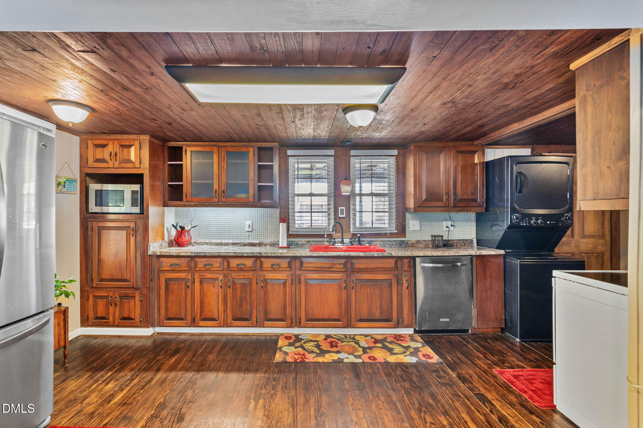 125 Branch Chapel Church Road Selma, NC 27576 - Photo 13 of 39 a kitchen with stainless steel appliances granite countertop a stove refrigerator and cabinets