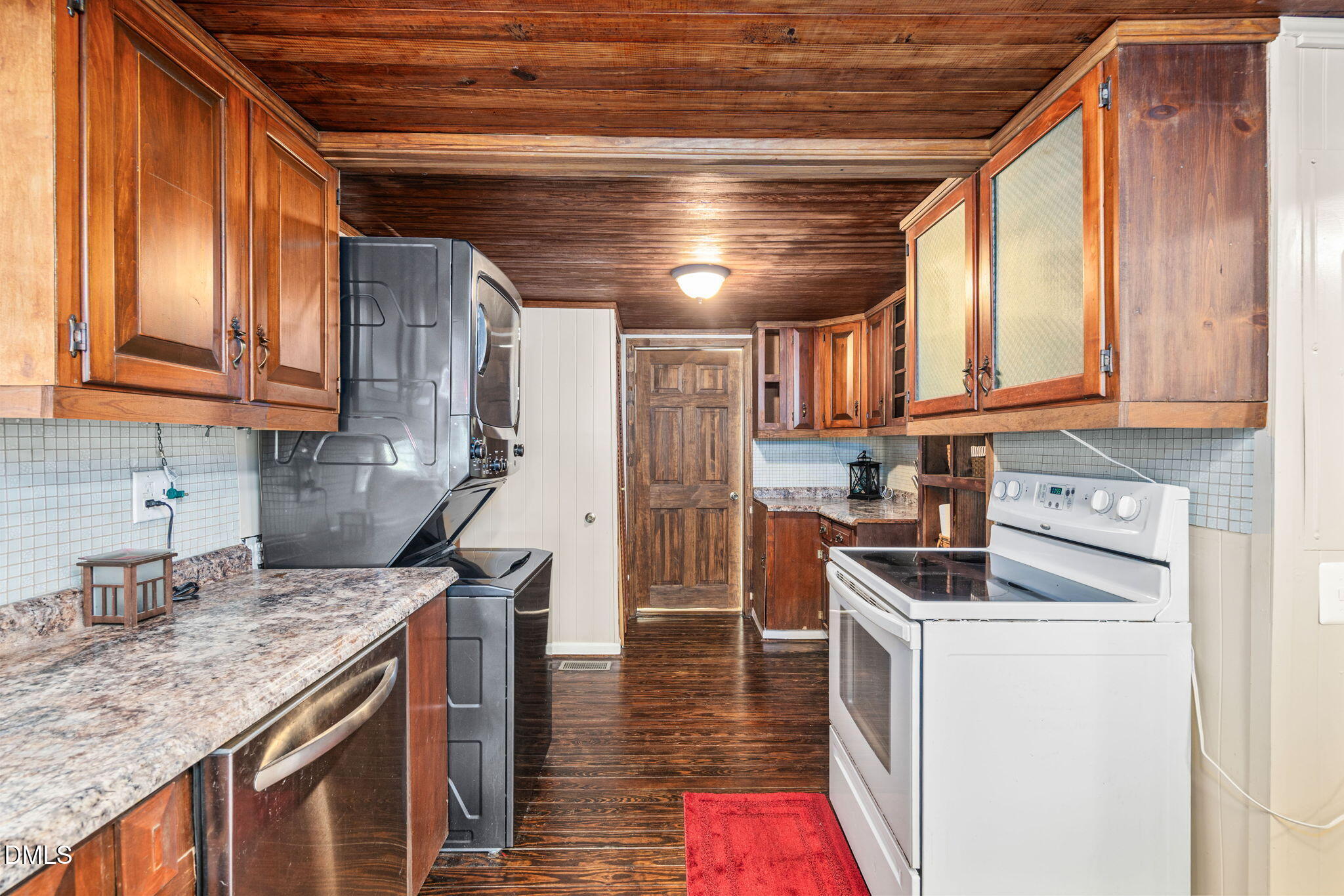 125 Branch Chapel Church Road Selma, NC 27576 - Photo 14 of 39 a kitchen with kitchen island granite countertop a sink a counter space appliances and cabinets