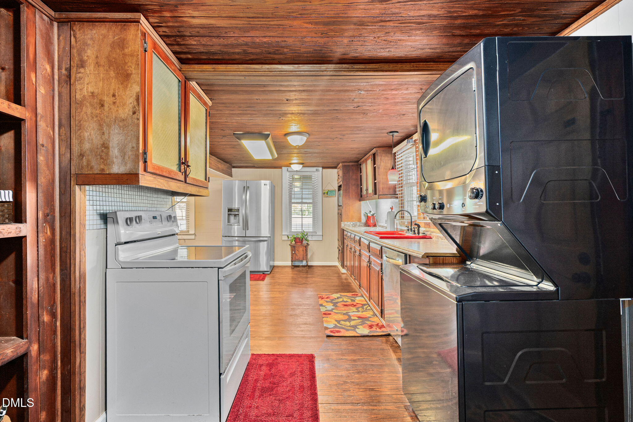 125 Branch Chapel Church Road Selma, NC 27576 - Photo 15 of 39 a kitchen with stainless steel appliances kitchen island granite countertop a stove and a refrigerator