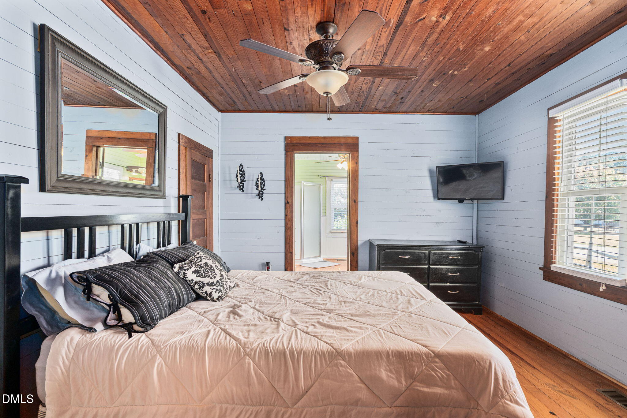 125 Branch Chapel Church Road Selma, NC 27576 - Photo 16 of 39 a bedroom with a bed and a flat screen tv