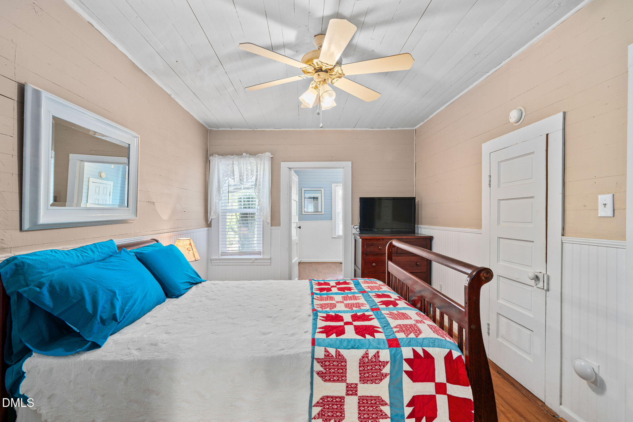 125 Branch Chapel Church Road Selma, NC 27576 - Photo 20 of 39 a bedroom with a bed and a chandelier