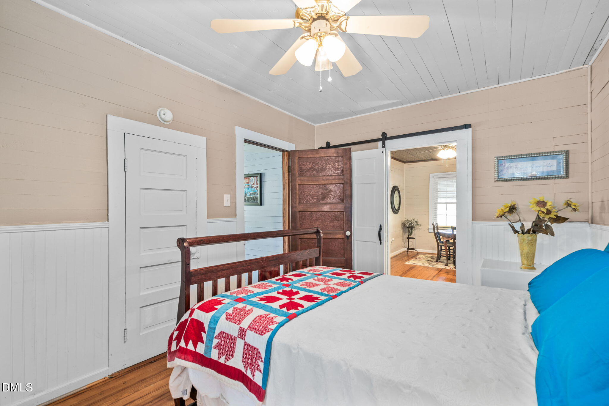 125 Branch Chapel Church Road Selma, NC 27576 - Photo 21 of 39 a bedroom with a bed and a chandelier