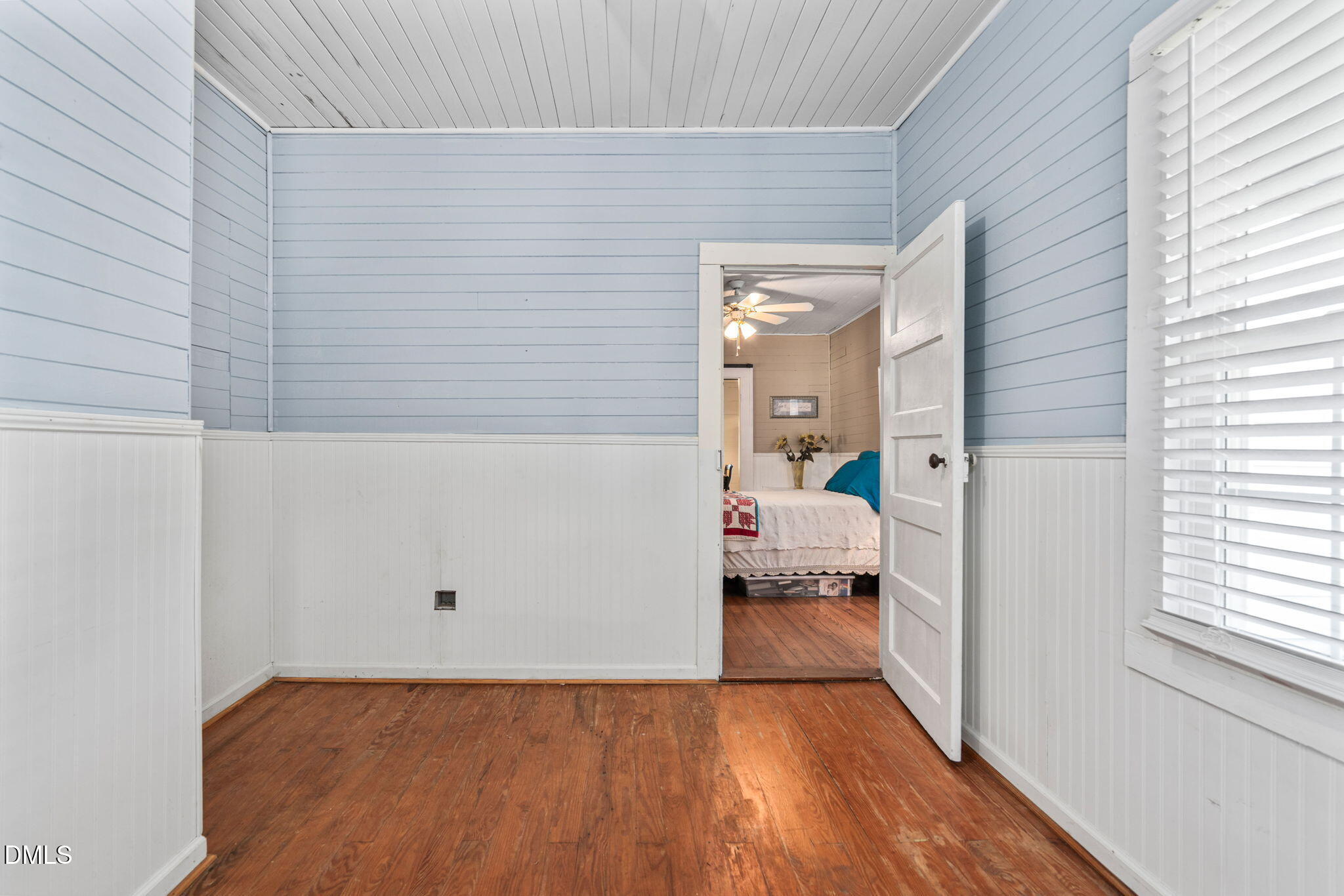 125 Branch Chapel Church Road Selma, NC 27576 - Photo 25 of 39 a view of a bedroom with wooden floor and a window