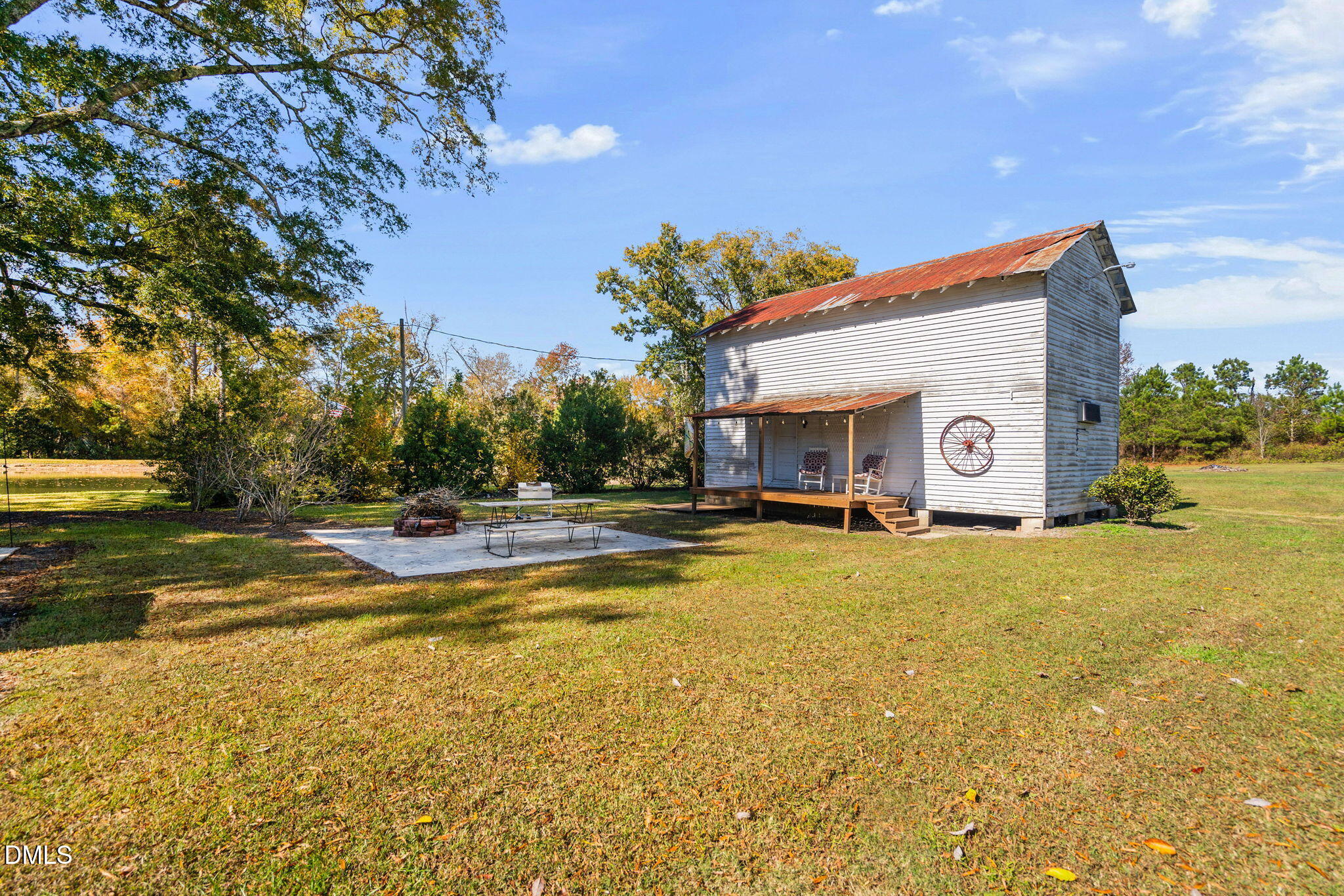 125 Branch Chapel Church Road Selma, NC 27576 - Photo 27 of 39 a view of swimming pool with outdoor seating and house in the background