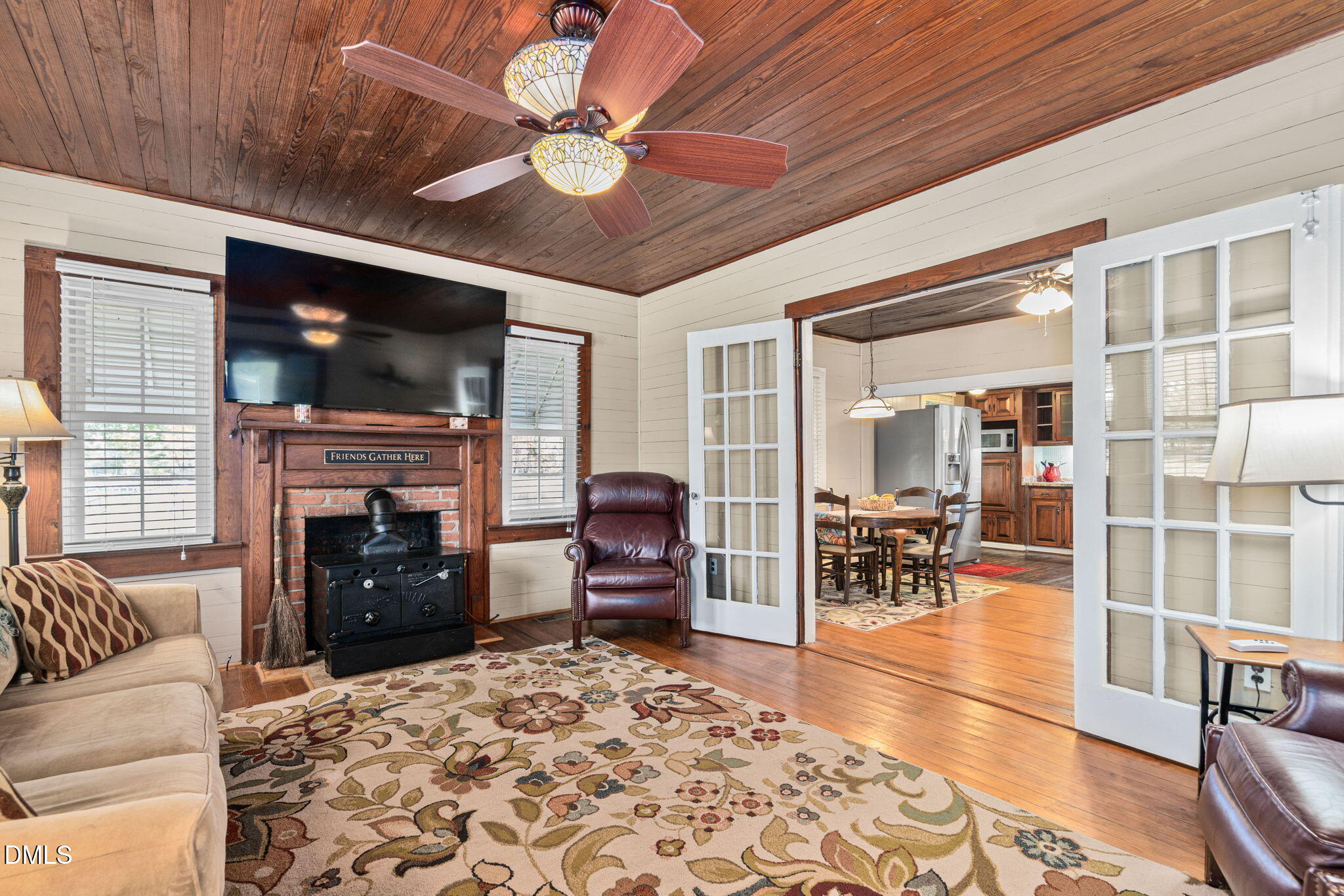 125 Branch Chapel Church Road Selma, NC 27576 - Photo 8 of 39 a living room with furniture a flat screen tv and a fireplace