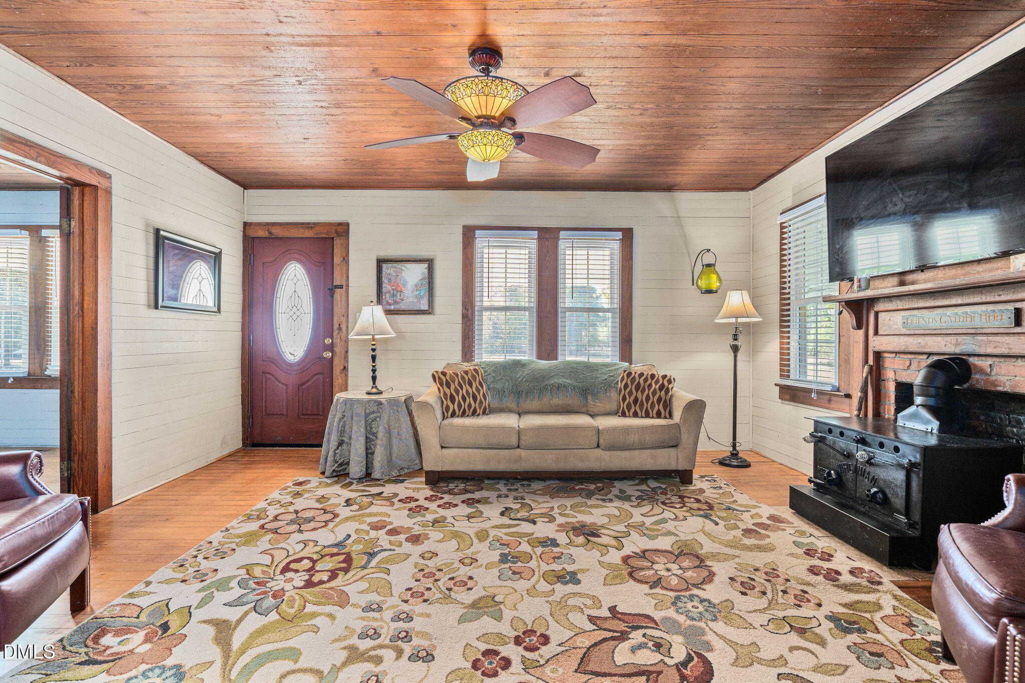 125 Branch Chapel Church Road Selma, NC 27576 - Photo 9 of 39 a living room with furniture and a fireplace