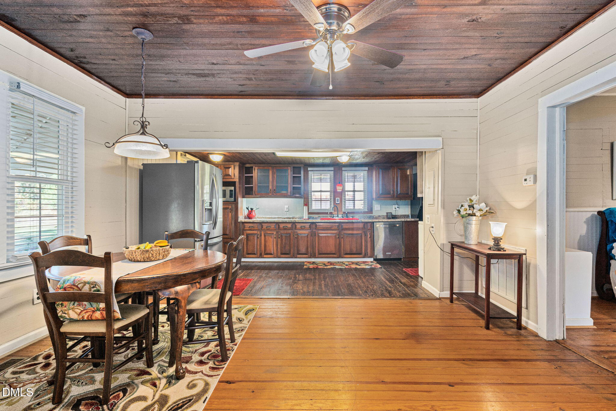 125 Branch Chapel Church Road Selma, NC 27576 - Photo 10 of 39 a room with stainless steel appliances kitchen island granite countertop furniture and a chandelier