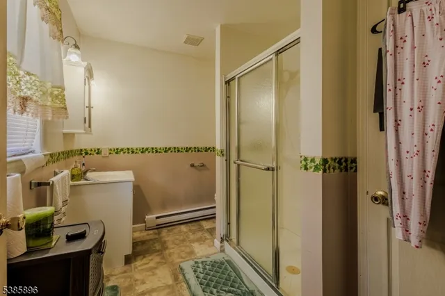 a bathroom with a shower and a toilet