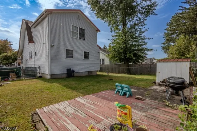 a view of a backyard with sitting area