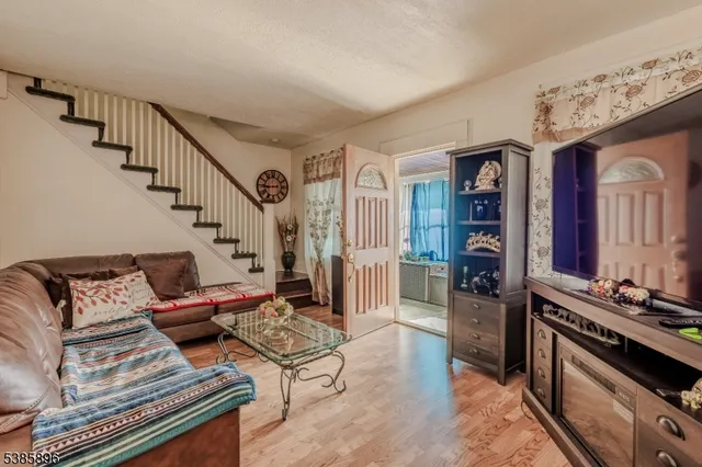 a living room with furniture and a stove